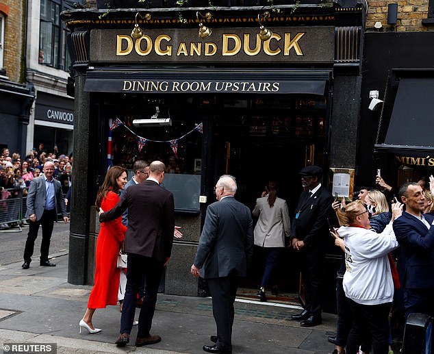Excited royal fans gathered in huge crowds to catch a glimpse of the couple as they arrived at the pub in Soho today