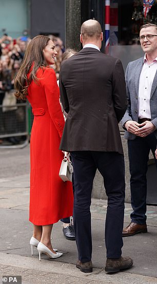 Kate appeared animated as she arrived today, cutting a striking figure in a vibrant coat from London boutique Eponine