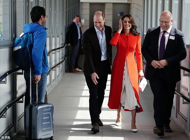 Travelling in style! One bemused commuter received an unexpected surprise when the Prince and Princess strolled past him