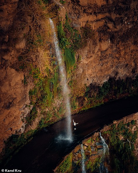 In this spectacular shot, the Anjos waterfall can be seen cascading over an old road, the highway ER101, in the south of the island