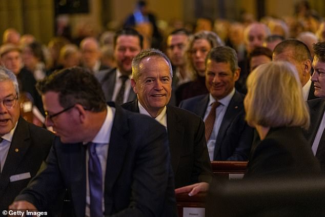Bill Shorten appeared in good spirits as he spoke with Ms Andrews, the premier's wife