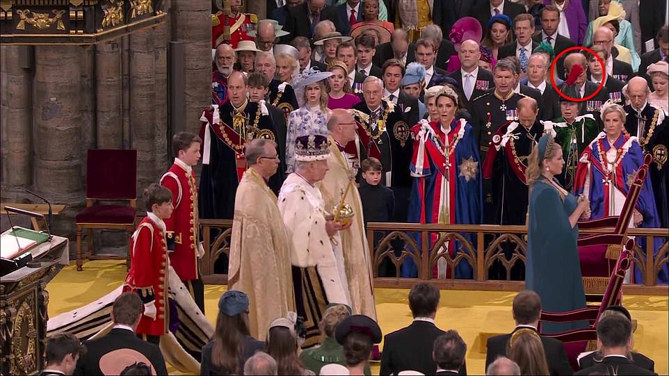 Much of Harry's reaction as his father exited the abbey was blocked by a feather on Princess Anne's hat