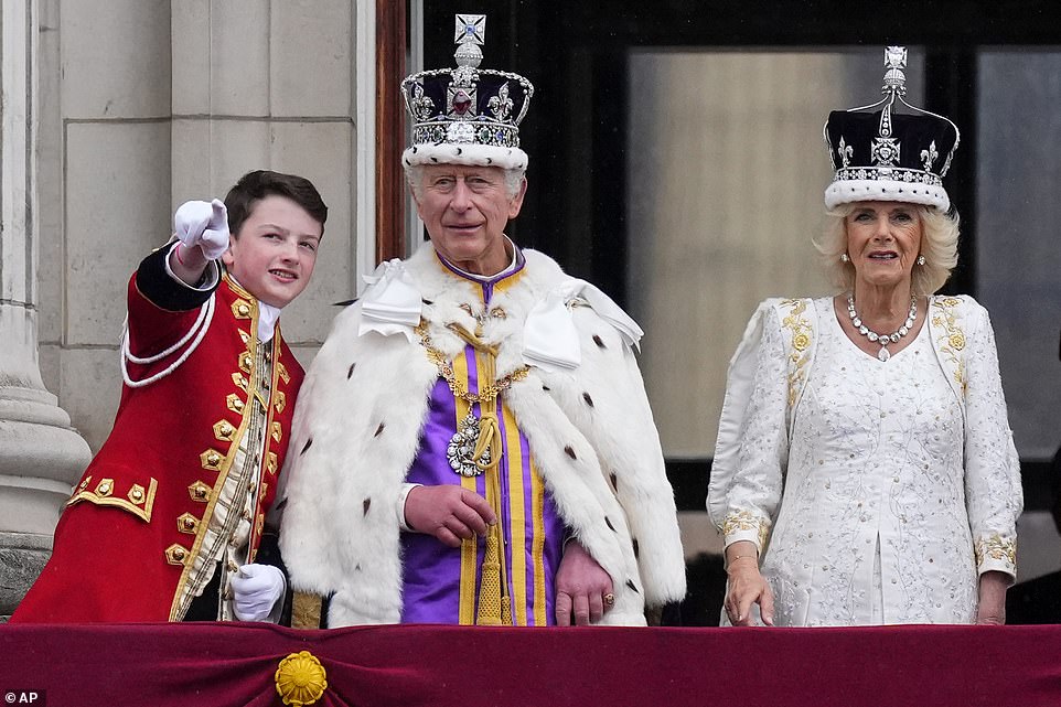 Britain's King Charles III and Queen Camilla stand with their family on the balcony of Buckingham Palace