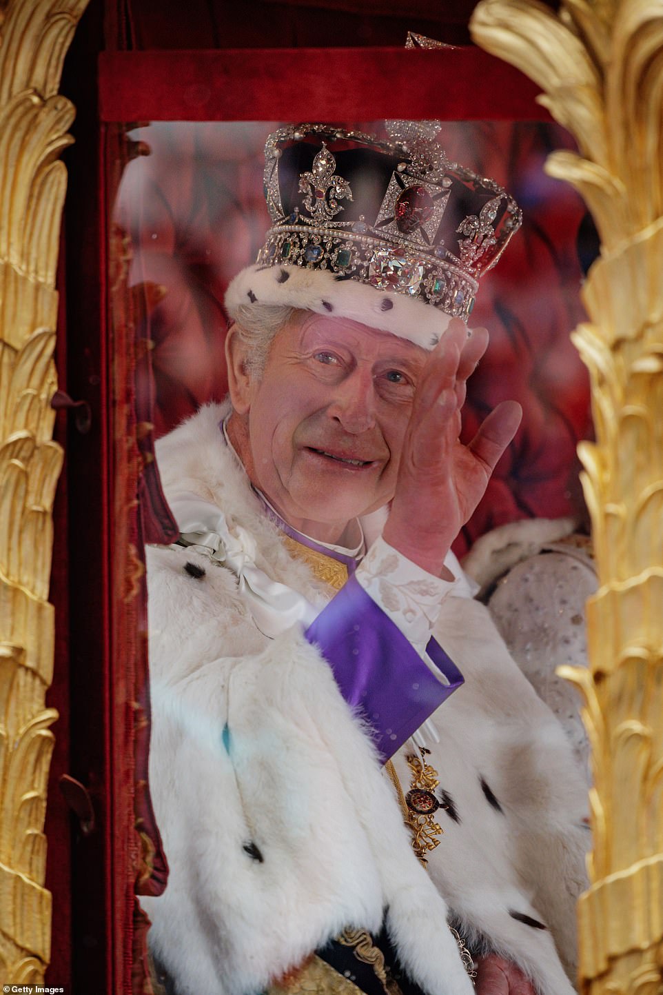 King Charles III waves from The Gold State Coach