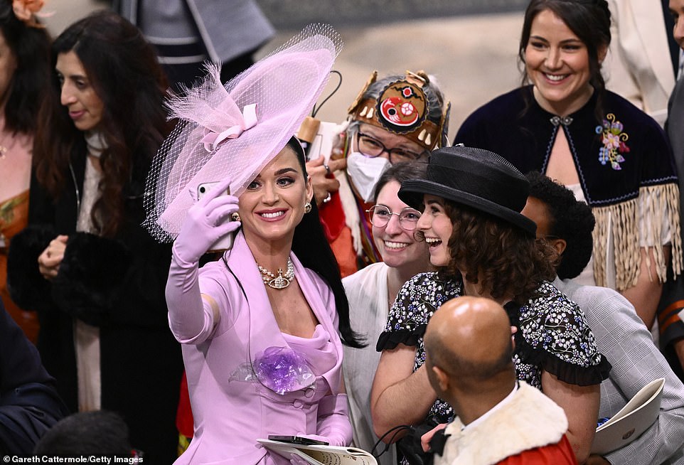 Katy Perry takes selfies with guests during the Coronation
