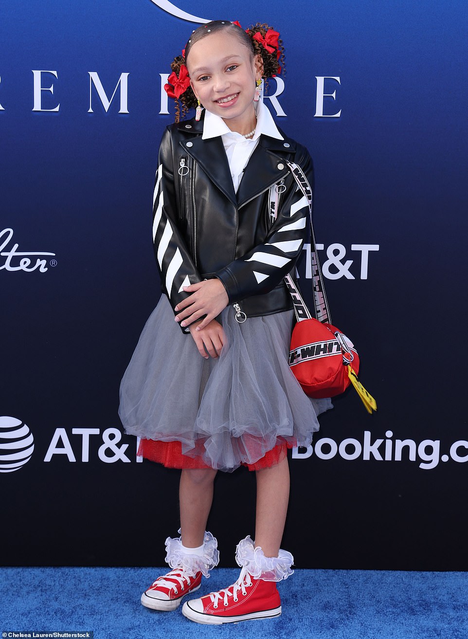Mykal-Michelle Harris was adorable in curled pigtail buns, a gray and red skirt, and snazzy biker jacket