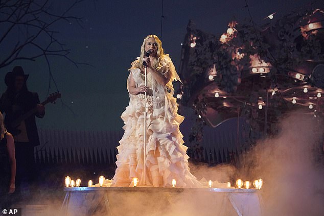 Stage presence: The country superstar, 39, commanded the stage looking ethereal in a stunning ruffled floor-length cream tulle ball gown