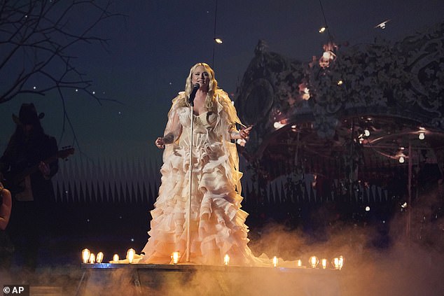 Magical: The scenery behind her matched the title of the ballad, as she performed in front of a real carousel