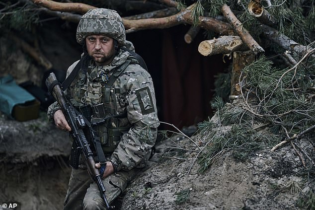 A Ukrainian soldier in a trench close to the Russian positions near Kremenna in the Luhansk region, Ukraine, on Tuesday