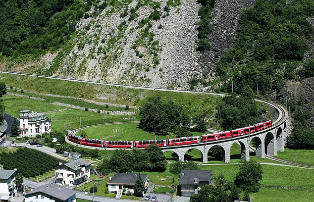 Pictured immediately above is the Bernina Express train negotiating the amazing 360ft-long Brusio spiral viaduct in Brusio, Switzerland