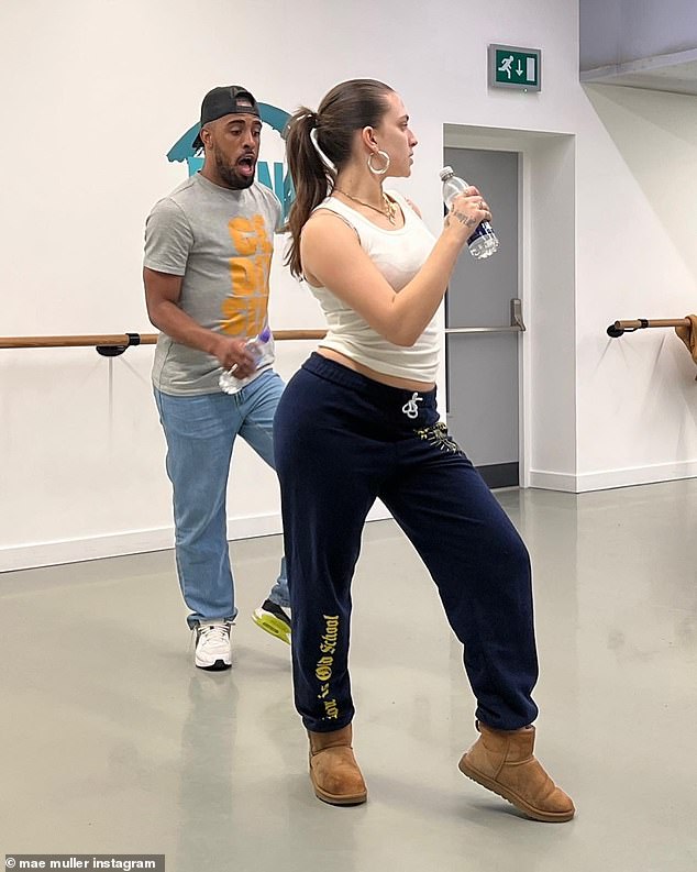 Behind the scenes: Another snap captured the pop star in a cosy outfit as she rehearsed one of her choreographies