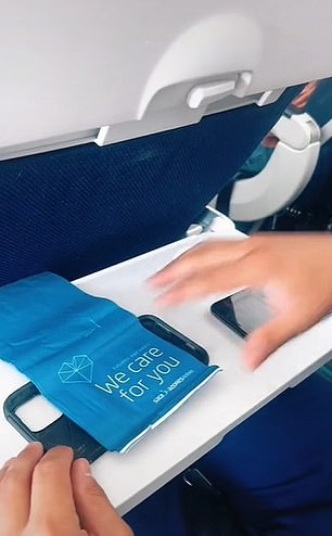 TikToker Maiifinds reveals an ingenious way to make a simple yet effective phone holder using a sick bag