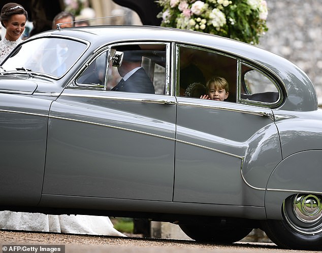 The Prince then appeared to cheer up as he was pictured smiling from inside a vintage Jaguar Mark IV on his way to the glamorous wedding reception
