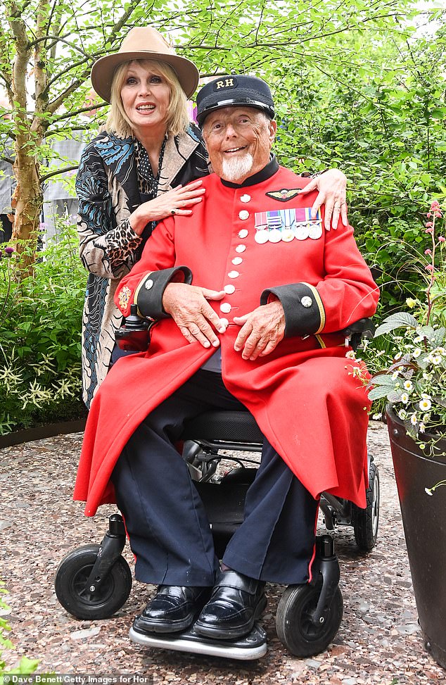 Joanna Lumley and a Chelsea Pensioner pose in Horatio's Garden designed by Charlotte Harris and Hugo Bugg at the RHS Chelsea Flower Show
