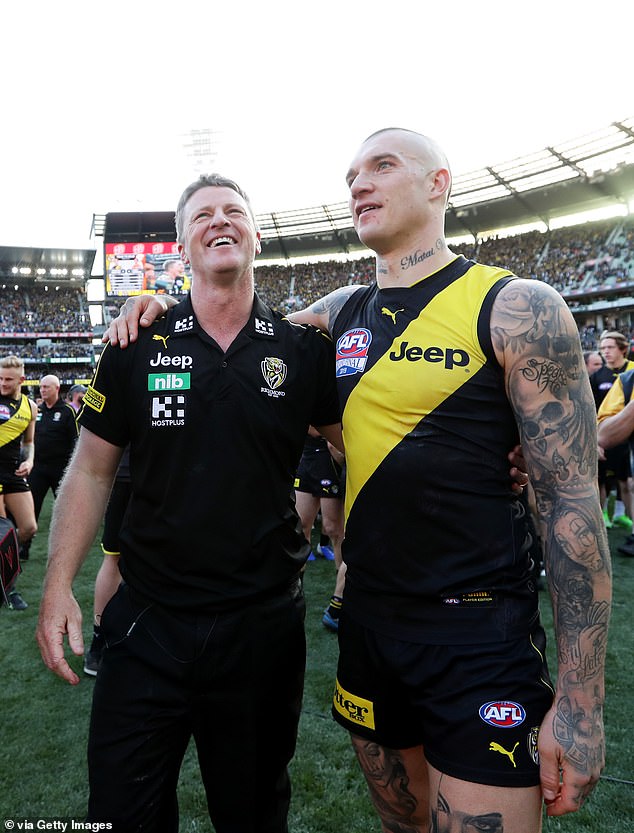 Hardwick has nurtured Tigers icons like Dustin Martin (pictured together after the 2019 grand final), who had some cheeky advice on what he should do after footy