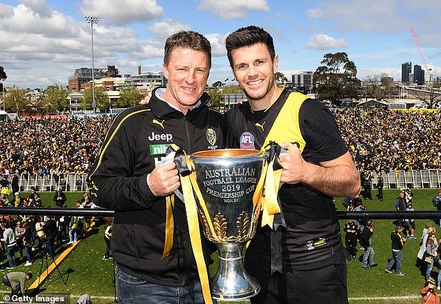 Hardwick and Trent Cotchin of the Tigers pose with the premiership trophy in 2019, one of three titles they would win in a golden era for the club