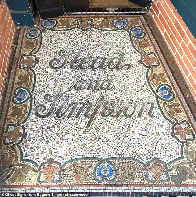 Ornate mosaic tiles on the doorstep of the former shoe shop 'Stead & Simpson' in Southwold, Suffolk