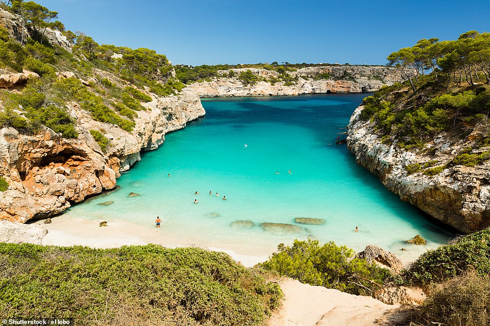 CALO DES MORO, MALLORCA, SPAIN: This breathtaking hidden cove is exactly what you would expect on the front of a luxury holiday brochure, and yet it is just a two-and-a-half-hour flight and £22 away from London. Holidaymakers describe it on Tripadvisor as 'the beach of all beaches', comparable to those in Thailand and the Caribbean - with 'just the dolphins and turtles missing'. We found direct Ryanair flights from London Stansted to Palma de Mallorca Airport for just £22 - and during the peak holiday season in August when you will want nothing more than to dive into its refreshing turquoise waters. The onward journey to the beach is just a 45-minute drive