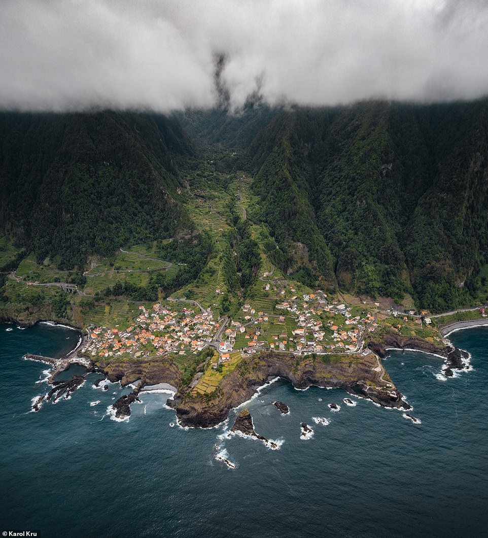 This mesmerising photograph shows the small village of Seixal on the northwest coast of Madeira on a cloudy afternoon. Karol notes that the town has access to a 'beautiful' black-sand beach
