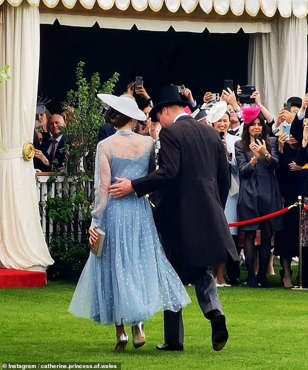 The Prince of Wales, 40, was pictured putting a loving arm around his wife as they left the Buckingham Palace garden party on Tuesday