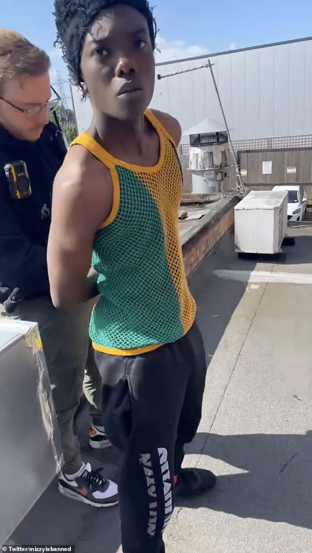 Mizzy, whose real name is Bacari-Bronze O'Garro, was filmed this morning being detained by a plain-clothes officer on what appeared to be the roof of a building