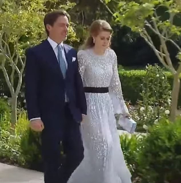 The royal, 34, lit up the room in her floral lace £675 dress, in dusky blue, from Needle & Thread as she walked in arm and arm with her husband Edoardo Mapelli Mozzi, 39
