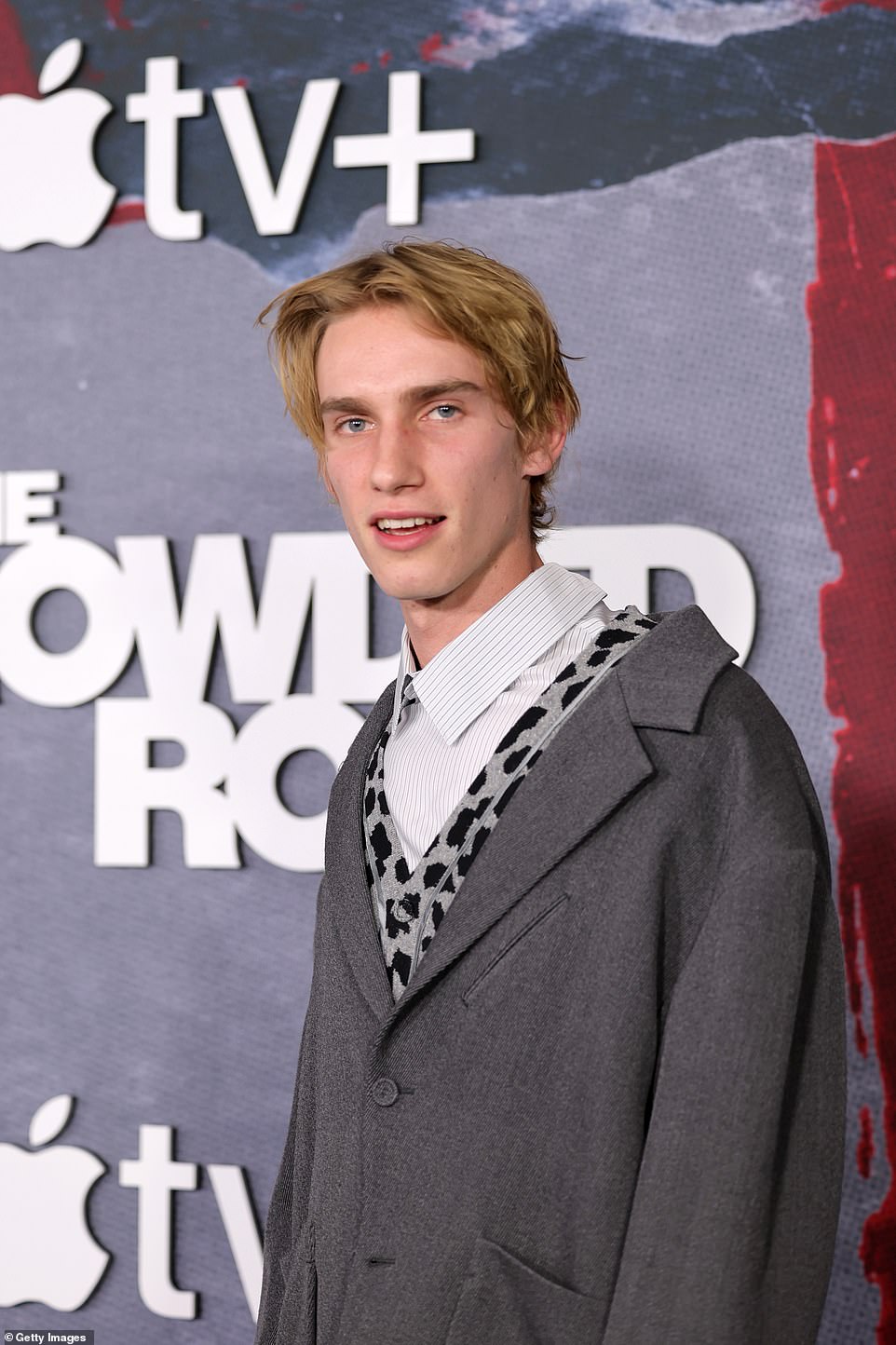 Quirky: The aspiring actor showed off his quirky style in a baggy gray blazer over a gray cheetah print cardigan and a striped button-up. Levon, 21, also donned baggy trousers and shiny black shoes