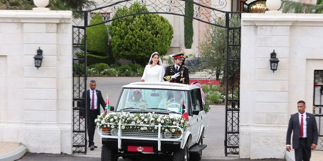 Jordans Crown Prince Hussein (R) and his wife Saudi Rajwa al-Seif in their car