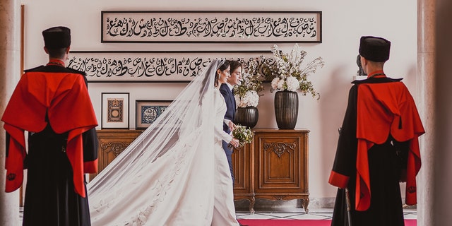 Royal family of Jordan walking to the side on their wedding day