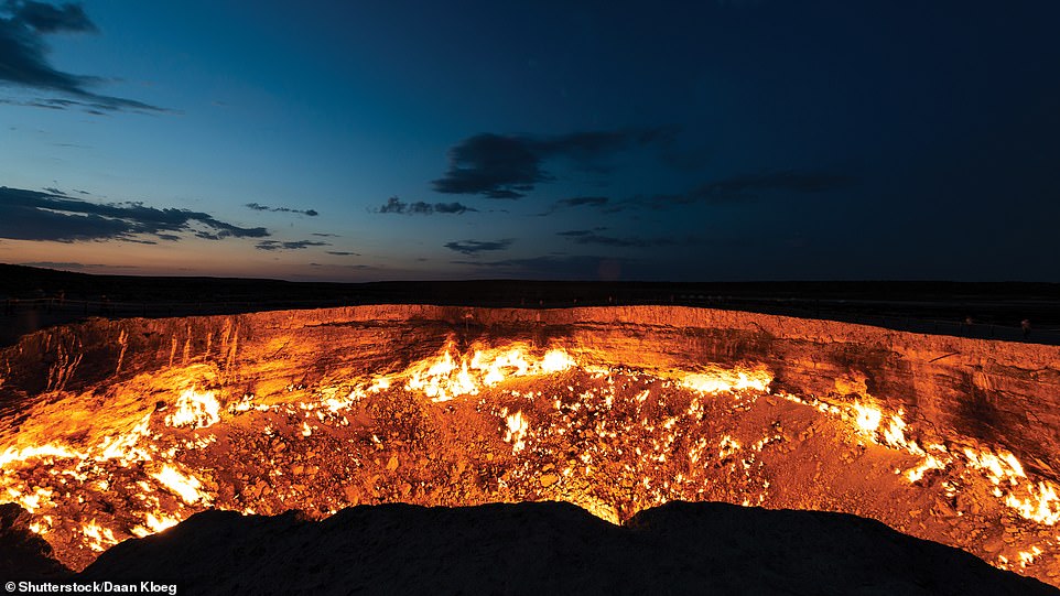 DARVAZA GAS CRATER, AHAL, TURKMENISTAN: Also known as the 'Door to Hell', Martin's book depicts this 69m (226ft)-wide crater that 'has been burning since 1971'. 'Locals believe it was set alight by Soviet geologists as they explored this natural gas field,' it adds. 'When the ground collapsed beneath their rig, they started the fire to stop the spread of methane'