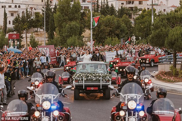 After the service, they waved to thousands of fans who had gathered on the streets of Amman, Jordan, as they were driven in a custom white Range Rover, followed by seven red Range Rovers