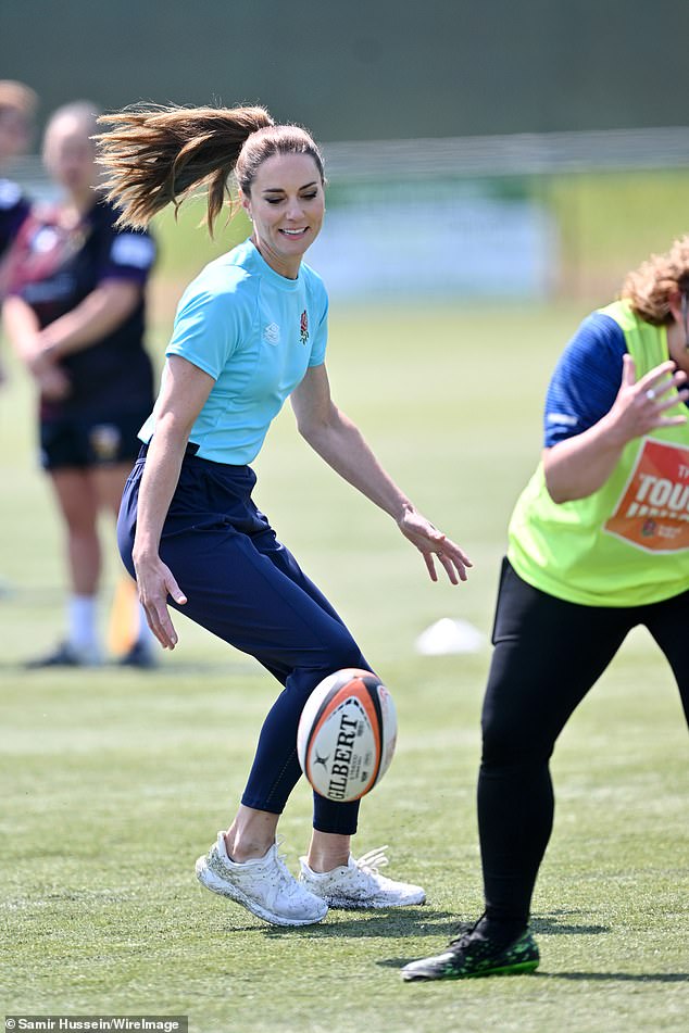 Kate showed her impressive agility as she darted around the pitch to catch the ball during rugby drills