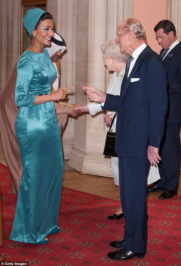Sheika Moza bint Nasser Al-Missned of Qatar is greeted by Queen Elizabeth II and Prince Phillip, Duke of Edinburgh, at a lunch for sovereign monarchs in honour of Queen Elizabeth II's Diamond Jubilee in 2012