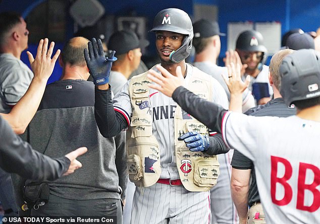 Minnesota Twins center fielder Michael A. Taylor (2) celebrates in the dugout after homering