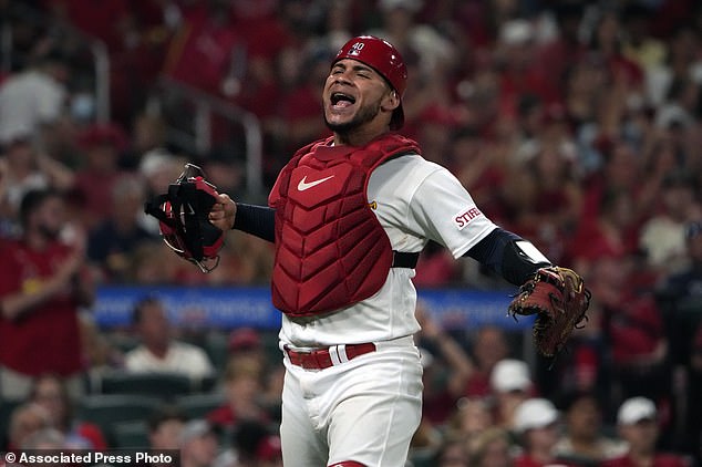 Cardinals catcher Willson Contreras celebrates after throwing the Reds' Will Benson out