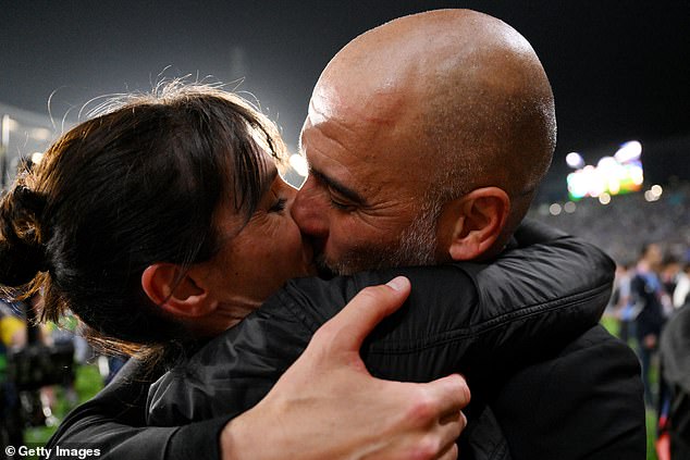 Pep Guardiola, Manager of Manchester City, celebrates with his wife Cristina Serra
