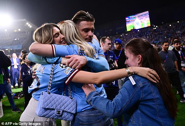 Jack Grealish celebrates with his girlfriend and relatives after winning the UEFA Champions League final