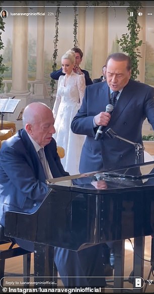Snaps online revealed how guests were serenaded by Berlusconi during the ceremony, who performed while a friend played the piano, before being gifted scarves for women, ties and watches for the men