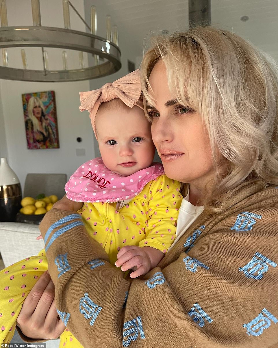What a cutie! Here she is seen at home with her daughter Royce