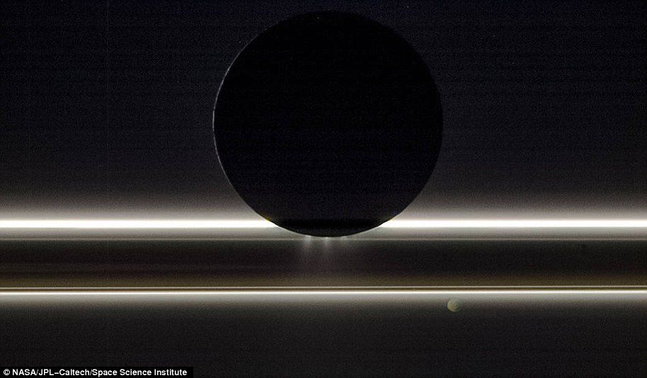 Cassini didn't just study Saturn - it also captured incredible views of its many moons. In the image above, Saturn's moon Enceladus can be seen drifting before the rings and the tiny moon Pandora. It was captured on Nov. 1, 2009, with the entire scene is backlit by the Sun