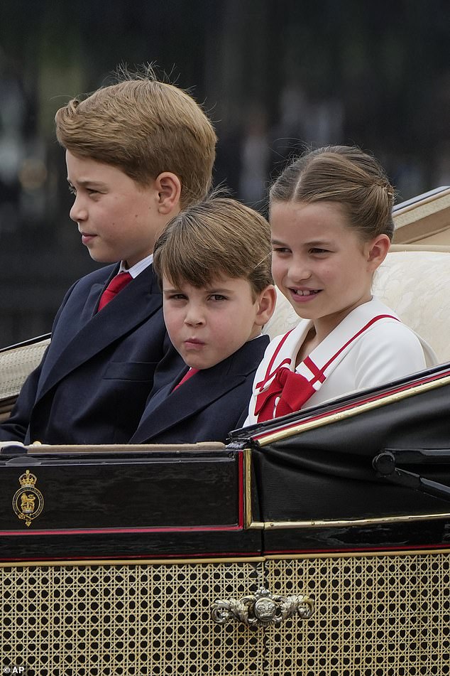 Prince Louis, five, is sat in-between Princess Charlotte and Prince George