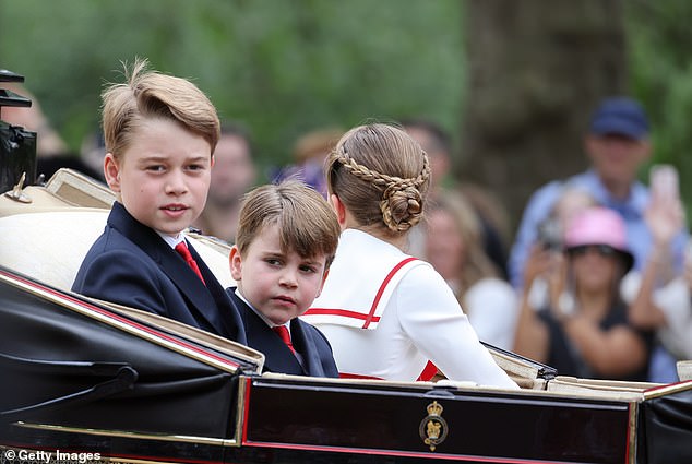 Prince George and Prince Louis look around at the crowd as they attend Trooping the Colour
