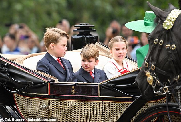 George, Charlotte and Louis chat amongst themselves as they travel to Horse Guards Parade