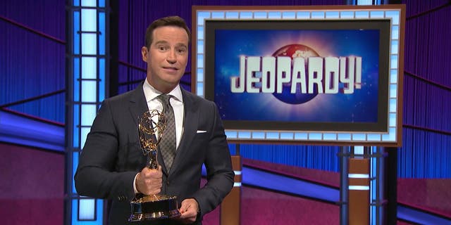 Jeopardy executive producer Mike Richards holds an Emmy