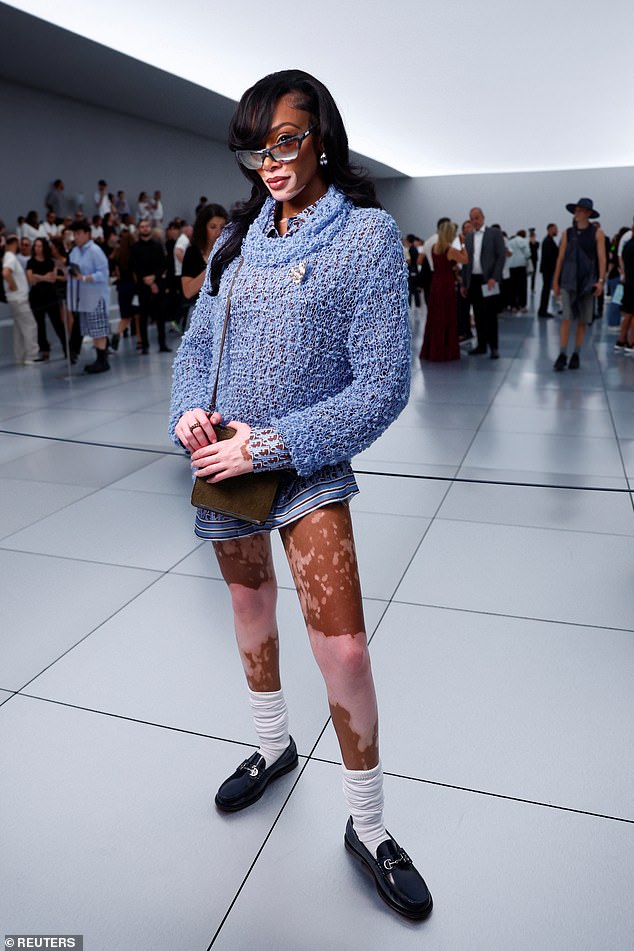 Leggy! Hot on her heels, was supermodel Winnie, 28, who flashed her toned pins in a striped silk mini dress, which she layered with a blue boucle jumper
