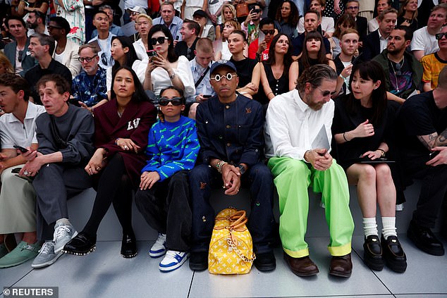 On the FROW! Pharrell Williams, his wife Helen Lasichanh and their son Rocket