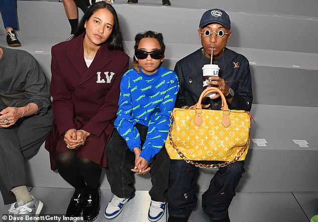 Chic: Pharrell sported a denim co-ord and carried a yellow bag