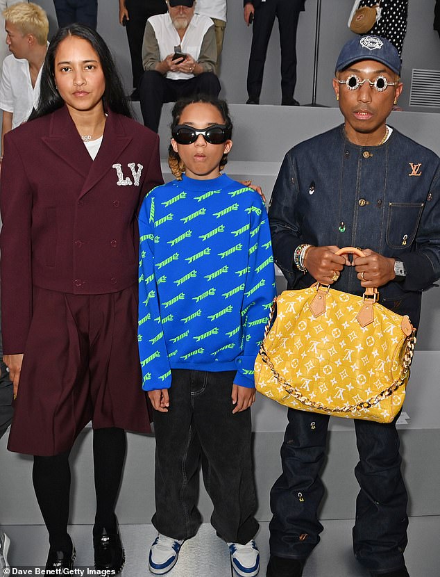 Family affair: Pharrell attended with his wife Helen Lasichanh and their son Rocket