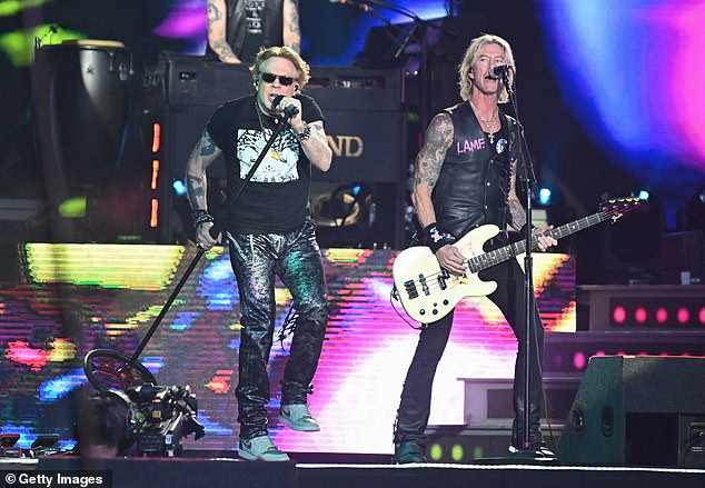 Rockers! Her performance on the Pyramid Stage came hours before headliners Guns N Roses took to the stage (pictured: Axl Rose and Duff McKagan)