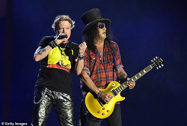 Crowd pleaser: Axl Rose and Slash put on a powerful performance as they rocked out to their hits